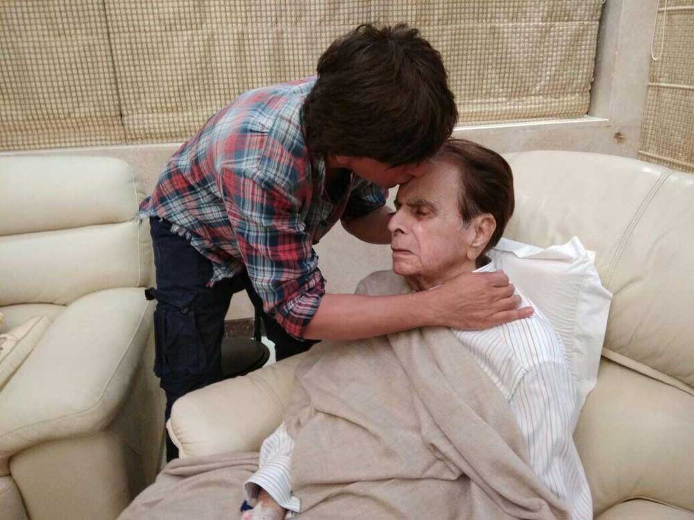 Shah Rukh Khan kisses a recovering Dilip Kumar on the forehead and it is such a father-son moment